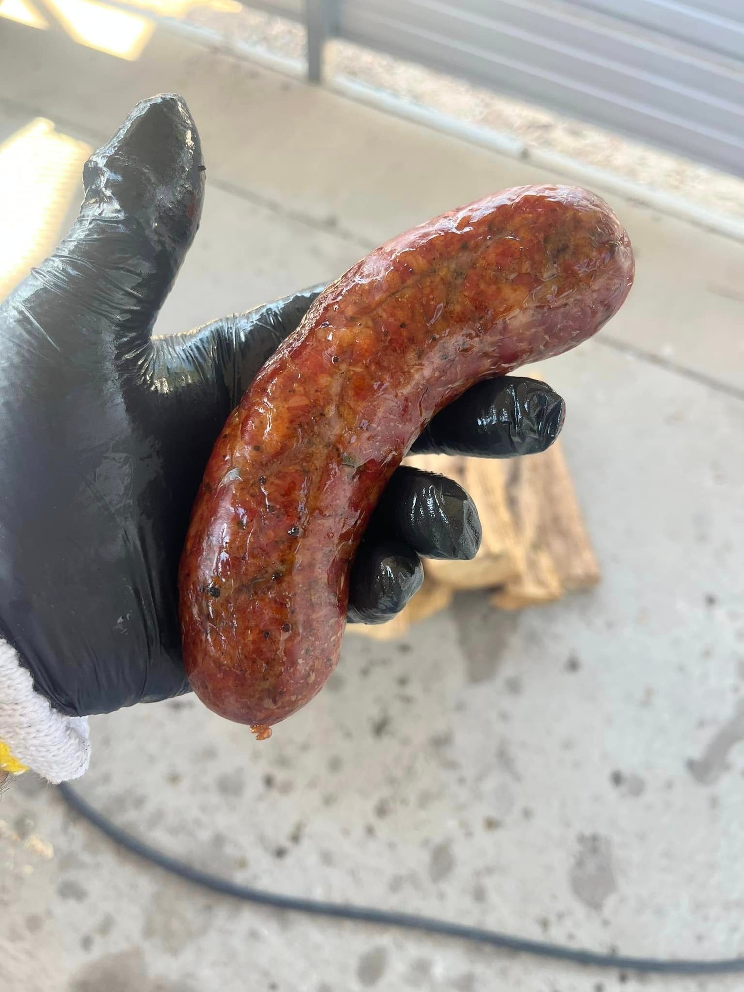Smoker grill with multiple meats cooking, process action shot